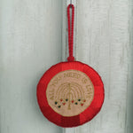 Token with embroidery
